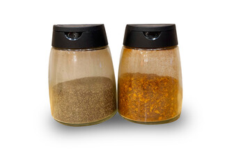 A bottle of food favoring, oregano and ground chilli or cayenne pepper  isolate on white background