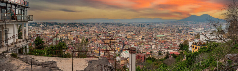 Fototapeta na wymiar Panoramic view of sunset over Napoli's city center, Mount Vesuvius in warning in the background