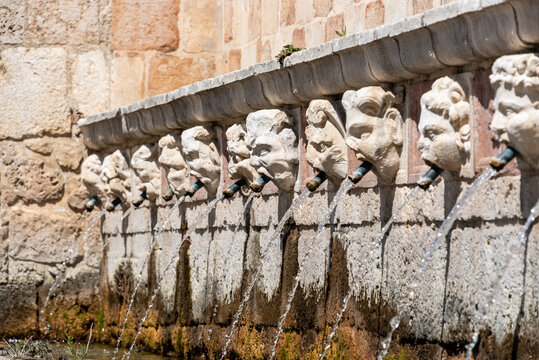 Famous mediaeval Fountain of 99 Spouts in ithe old town of L'Aquila, Italy