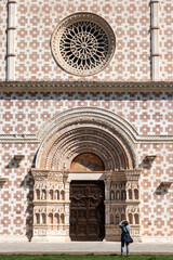 Typical Romanesque rose window of the portal of Basilica Santa Maria di Collemaggio in L'Aquila,...
