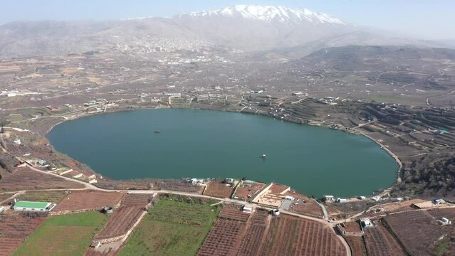 Ram Lake and snowy mount Hermon in Northern Israel, Drone footage.