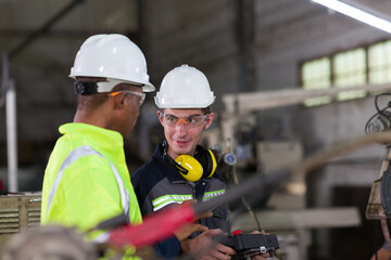 Group of engineer working with robot controller for maintenance or repair in industry factory. Team...