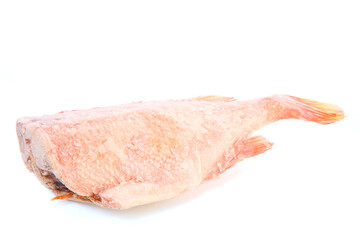 Frozen sea bass without a head. Frozen red fish Frost on the surface of the fish. Ice.