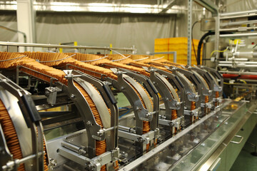 A lot of cookies on the production line. The flow of sweets before packaging. Packing crackers on...
