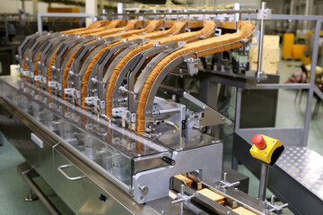 A lot of cookies on the production line. The flow of sweets before packaging. Packing crackers on...