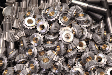 Lots of parts for big cars. Gears, shafts, sprockets in large quantities. Spare parts for mining combines. Miners of the coal industry.