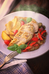 delicious grilled chicken breast served with vegetables and potatoes