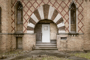 Brick building with intricate designs left abandoned