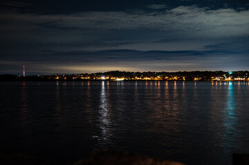 Fototapeta na wymiar centennial beach barrie at night time building lights boat yard all in view 