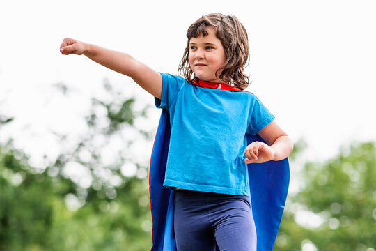 Brave superhero raising arms and screaming