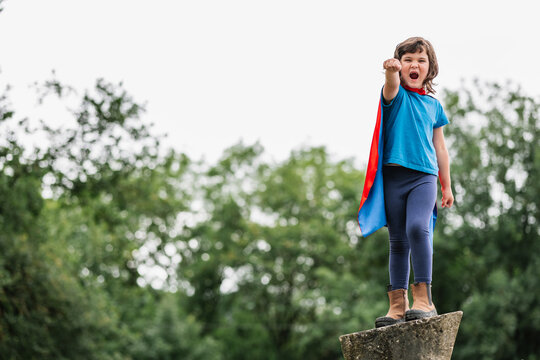 Brave superhero raising arms and screaming
