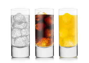 Lemonade drink with cola and orange soda soft drink with ice cubes on white background. in highball...