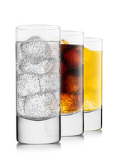Lemonade drink with cola and orange soda with ice cubes on white background in highball glasses.