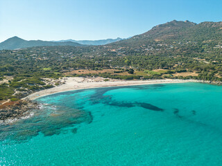 Fototapeta na wymiar Aerial view of the clear turquoise Mediterranean sea at Bodri beach in the Balagne region of Corsica