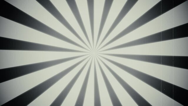 Vintage style, rotating black and white sunburst circle motion background. Retro animation with rays or stripes. Old look effects included; scratches, noise, dust, dirt, washed out. 4k, seamless loop.