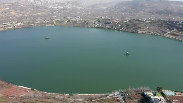 Ram Lake and snowy mount Hermon in Northern Israel, Drone footage.