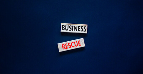 Business rescue symbol. Concept words Business rescue on wooden blocks on a beautiful black table black background. Business rescue and support concept. Copy space.