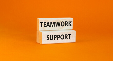 Teamwork support symbol. Concept words Teamwork support on wooden blocks on a beautiful orange table orange background. Business and teamwork support concept. Copy space.