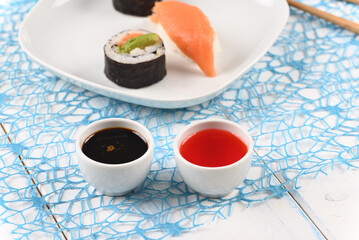 Sauce for sushi in white bowl.