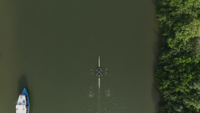 Sport Kayaks rowing on tranquil river water, Aerial view.