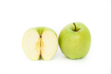 Fresh green apple and a half of an apple in a cut on a white background 