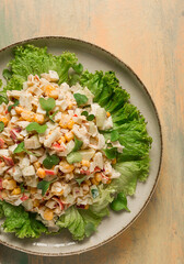 Canned corn salad, with crab sticks, top view, no people,