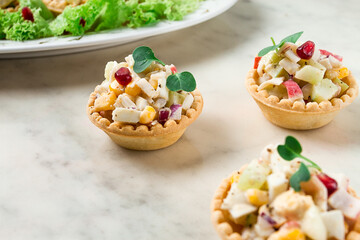 canapes with salad, corn with crab sticks, appetizer, portioned, close-up, no people,