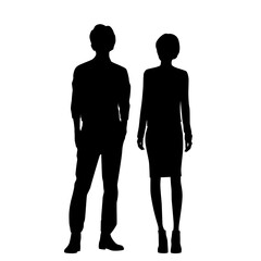 Vector silhouettes of  man and a woman, a couple of standing  business people, black  color isolated on white background