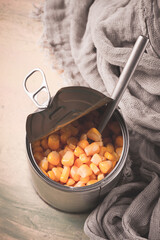 Fototapeta premium Open tin can, with corn, top view, selective focus, no people, close-up,