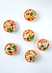 canapes with salad, corn with crab sticks, appetizer, portioned, close-up, no people,