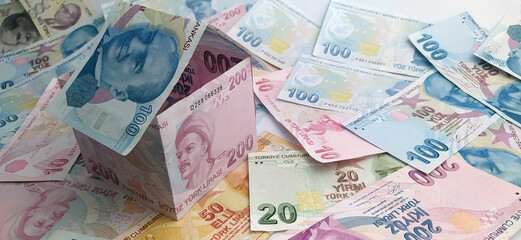 Turkish lira banknotes in the form of paper house.