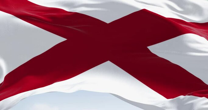 The state flag of Alabama waving in the wind