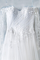 Naklejka na ściany i meble Beige wedding dress with lace. Details closeup