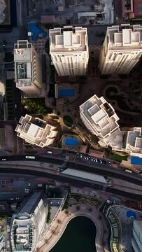 Top view of Dubai city. Aerial Drone fly over Dubai Marina skyscrapers and beach