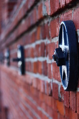black metal on red brick wall