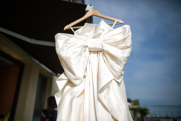 Beige wedding dress with a large bow