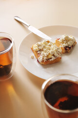 tea and waffles with fruits and curd cream for breakfast close-up