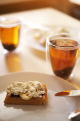 tea and waffles with fruits and curd cream for breakfast close-up