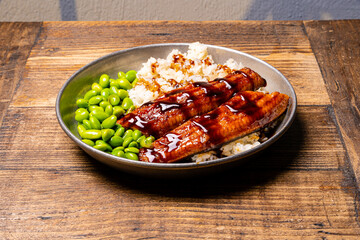 Sushi steel plate on wood table.
