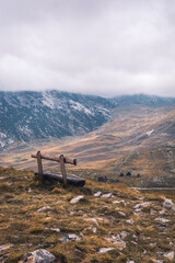 Empty bench watching over a mountain range in Durmitor national park, Montenegro