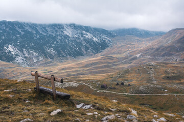 Empty bench watching over a mountain range in Durmitor national park, Montenegro