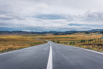 Empty mountain road on cloudy day. Dramatic and picturesque scene. Location famous place National park Durmitor, Montenegro, Balkans. Village Zabljak, Europe. .