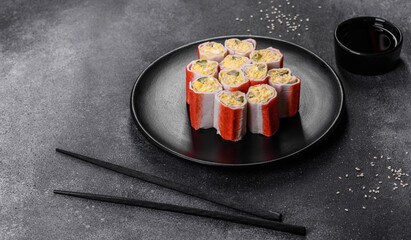 Crab sticks stuffed with rice, egg and green onions © chernikovatv