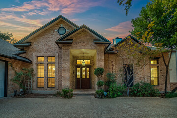Brick home at sunset