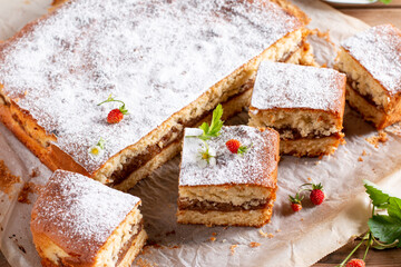 Clasic sponge cake with apples on table, selective focus. Homemade cake