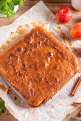 Clasic sponge cake, selective focus. Homemade pie on wooden background