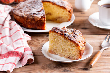 Clasic sponge cake, selective focus. Homemade pie on rustic wooden table