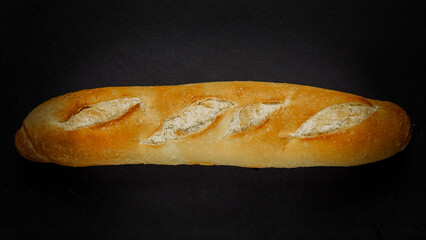 Fresh bread baguette loaf with seeds in a rustic style. Baking homemade healthy bread