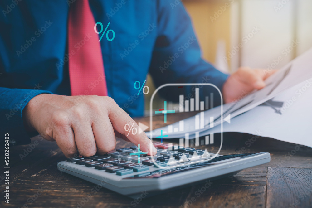 Aufkleber businessman works on analyzing financial data using a calculator and writing notes with calculations