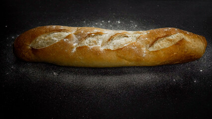 Fresh bread baguette loaf with seeds in a rustic style. Baking homemade healthy bread